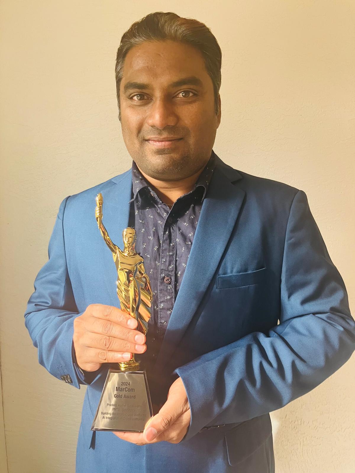 Pradeep Kumar Saraswathi Holding Marcom Award for Excellence in User Interface Architecture in Building No-code/Low-code Digital Experience Platforms and AI Integration